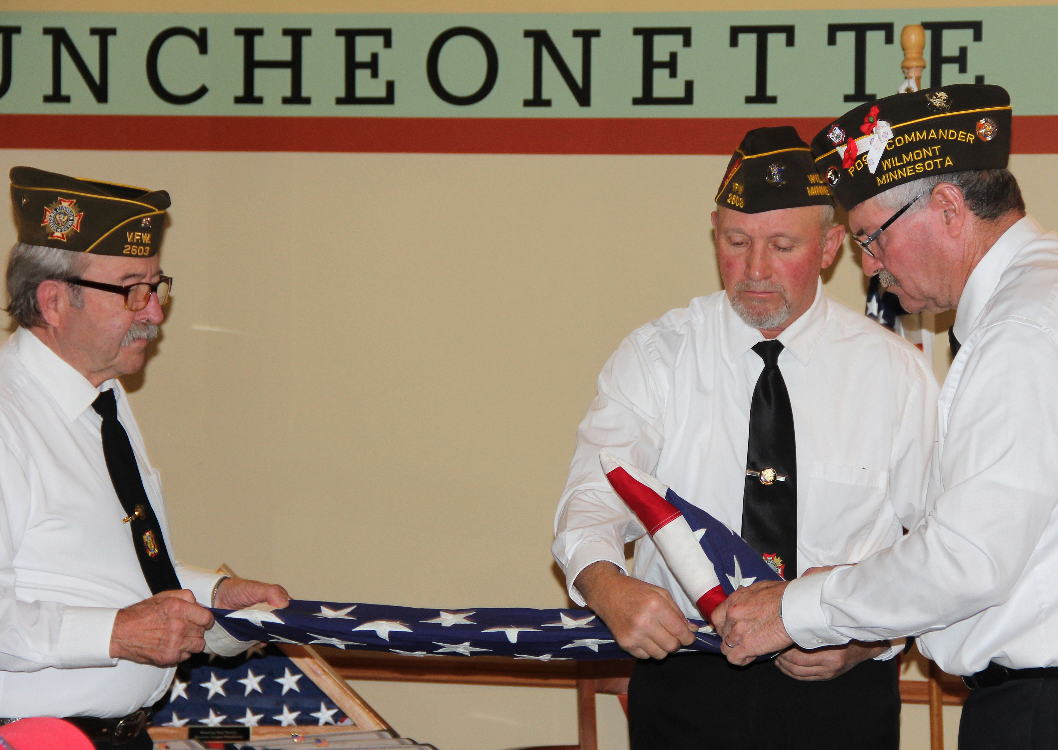 Wilmont VFW demonstrates flag folding during Veterans Day program at Ecumen Meadows - Vimarsana News