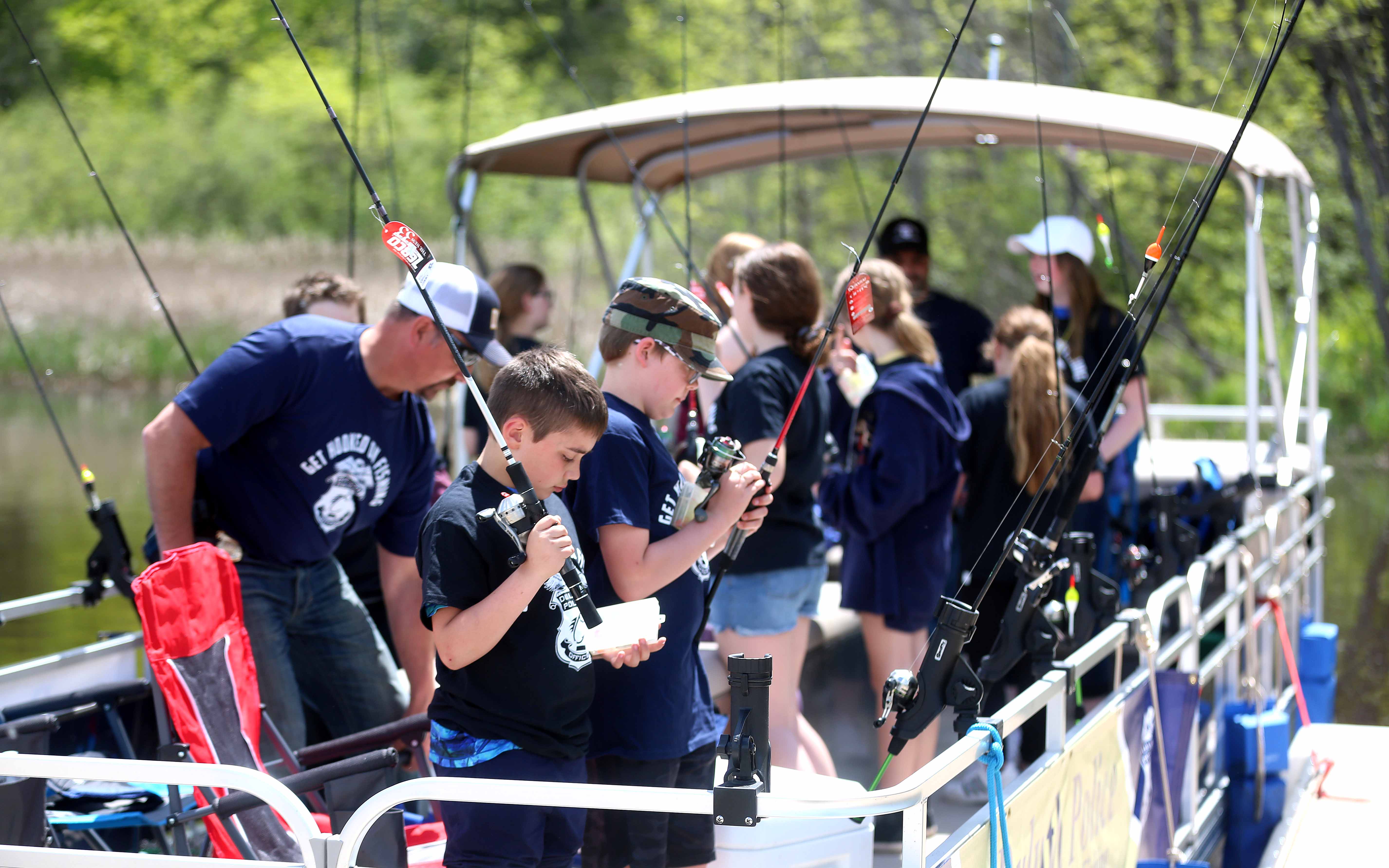 Reeling in relationships: Duluth police connect with kids through fishing - Vimarsana News